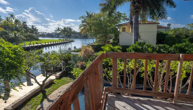 a balcony with wooden floor and outdoor space