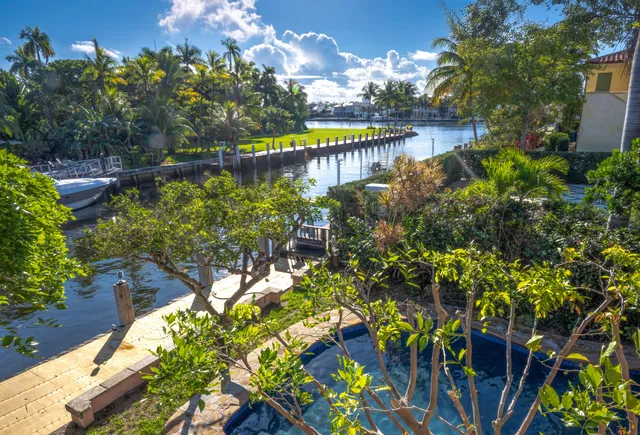 a view of a back yard of the house and swimming pool
