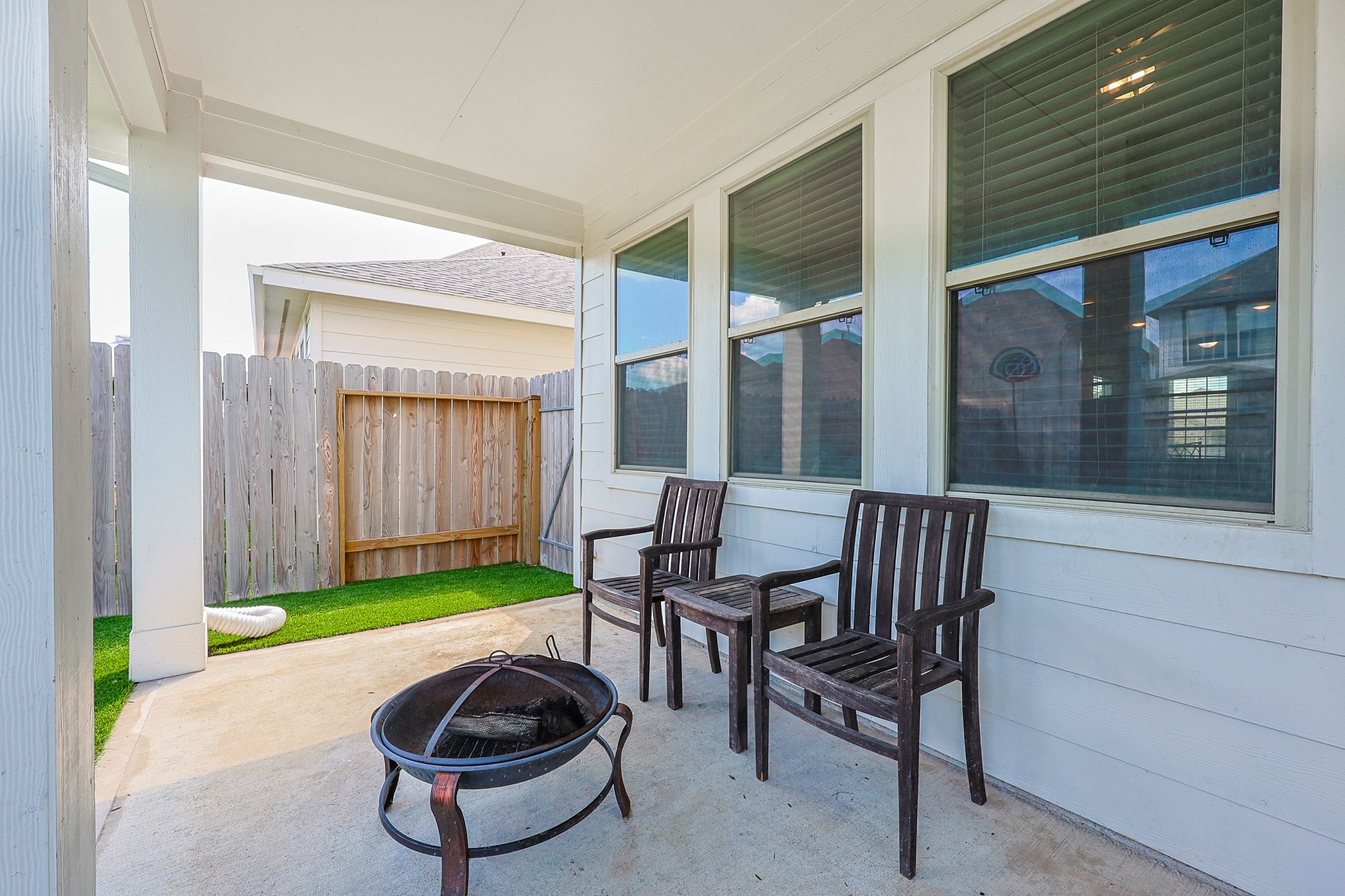 10423 Rochester Hls Lane Tomball, TX 77375 - Photo 30 of 36 Step out to this backyard covered patio.