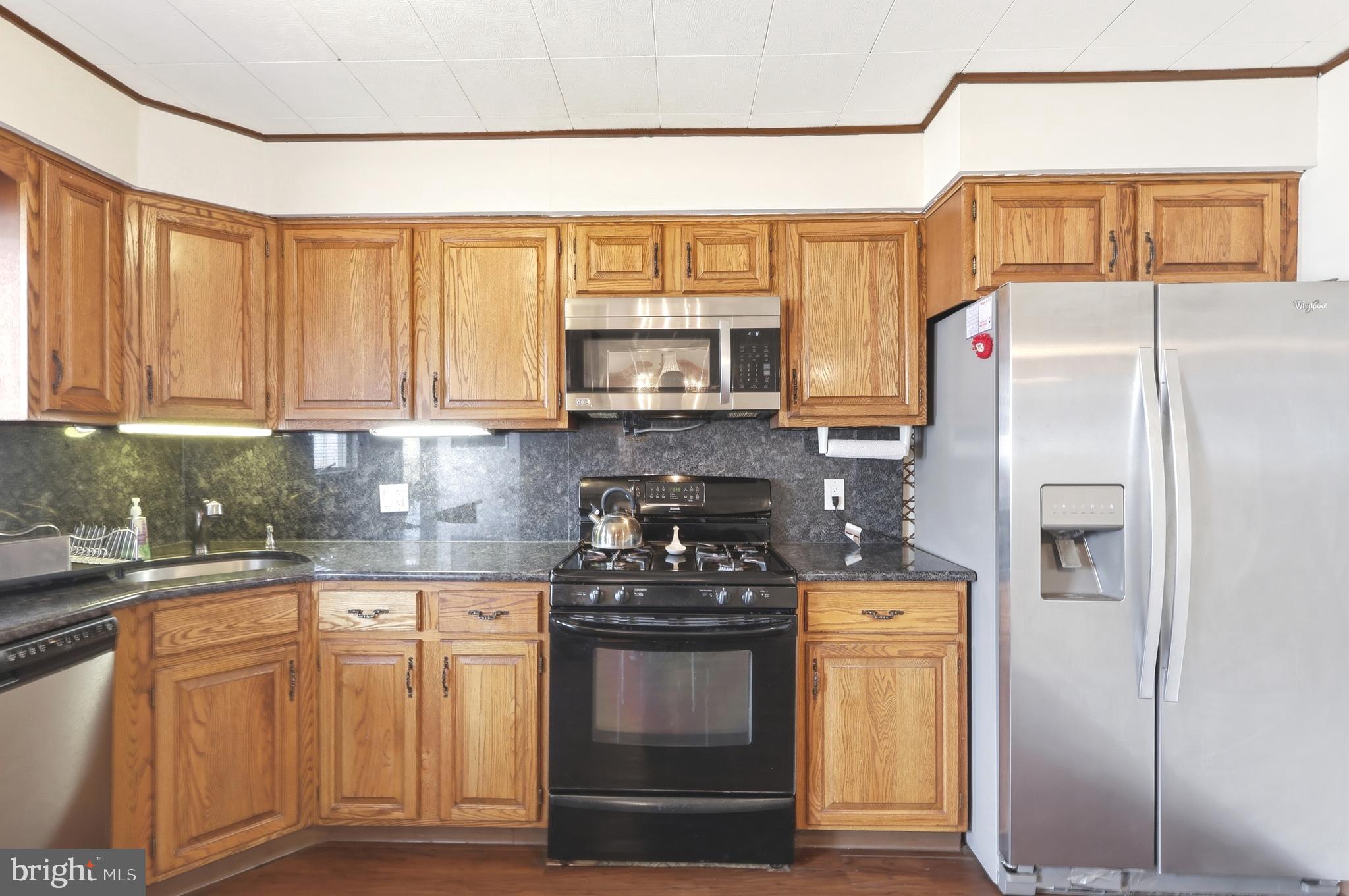 123 Pocasset Road Philadelphia, PA 19115 - Photo 13 of 35 a kitchen with a refrigerator and a sink