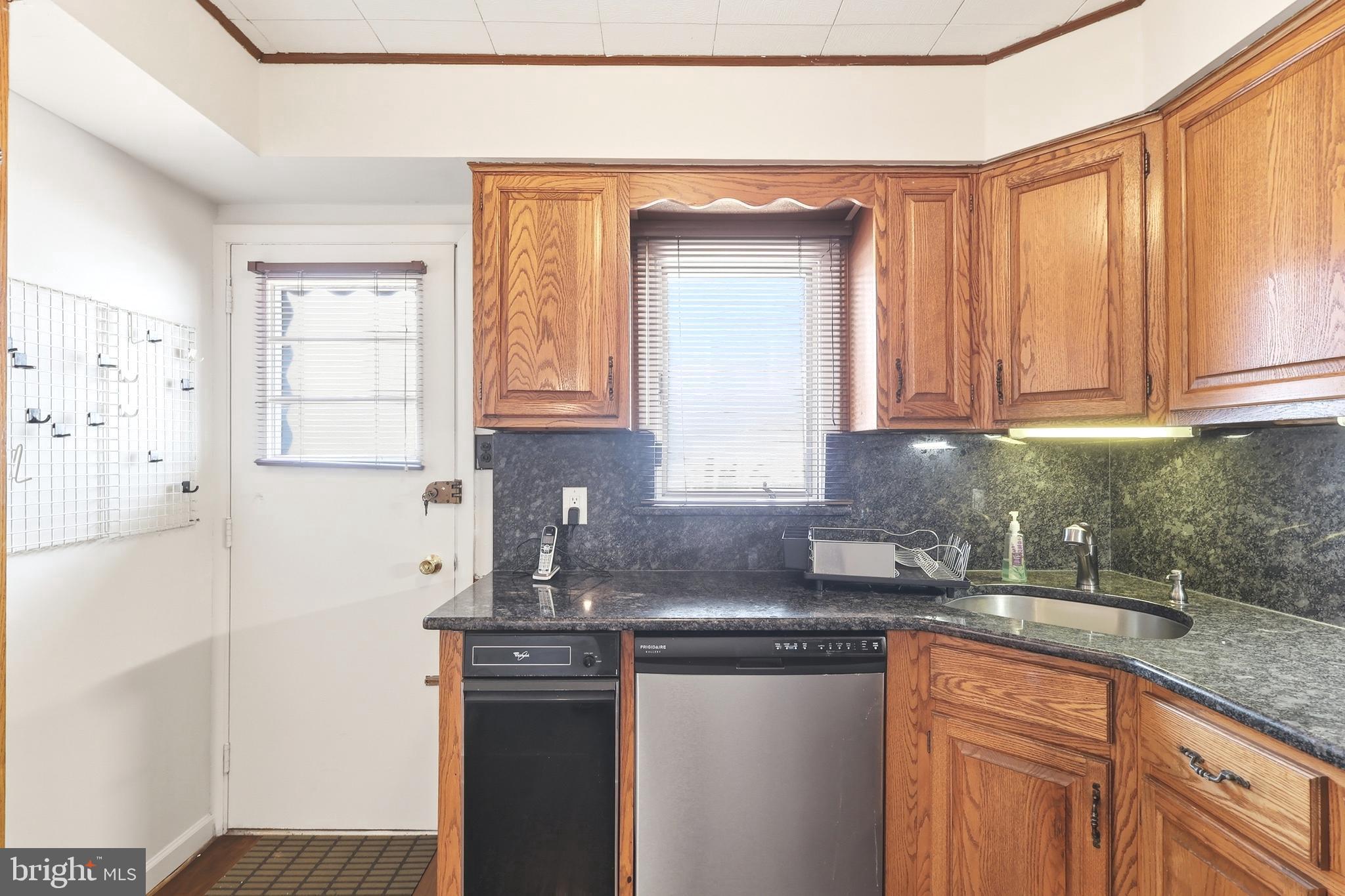 123 Pocasset Road Philadelphia, PA 19115 - Photo 15 of 35 a kitchen with stainless steel appliances granite countertop a sink a stove and a microwave