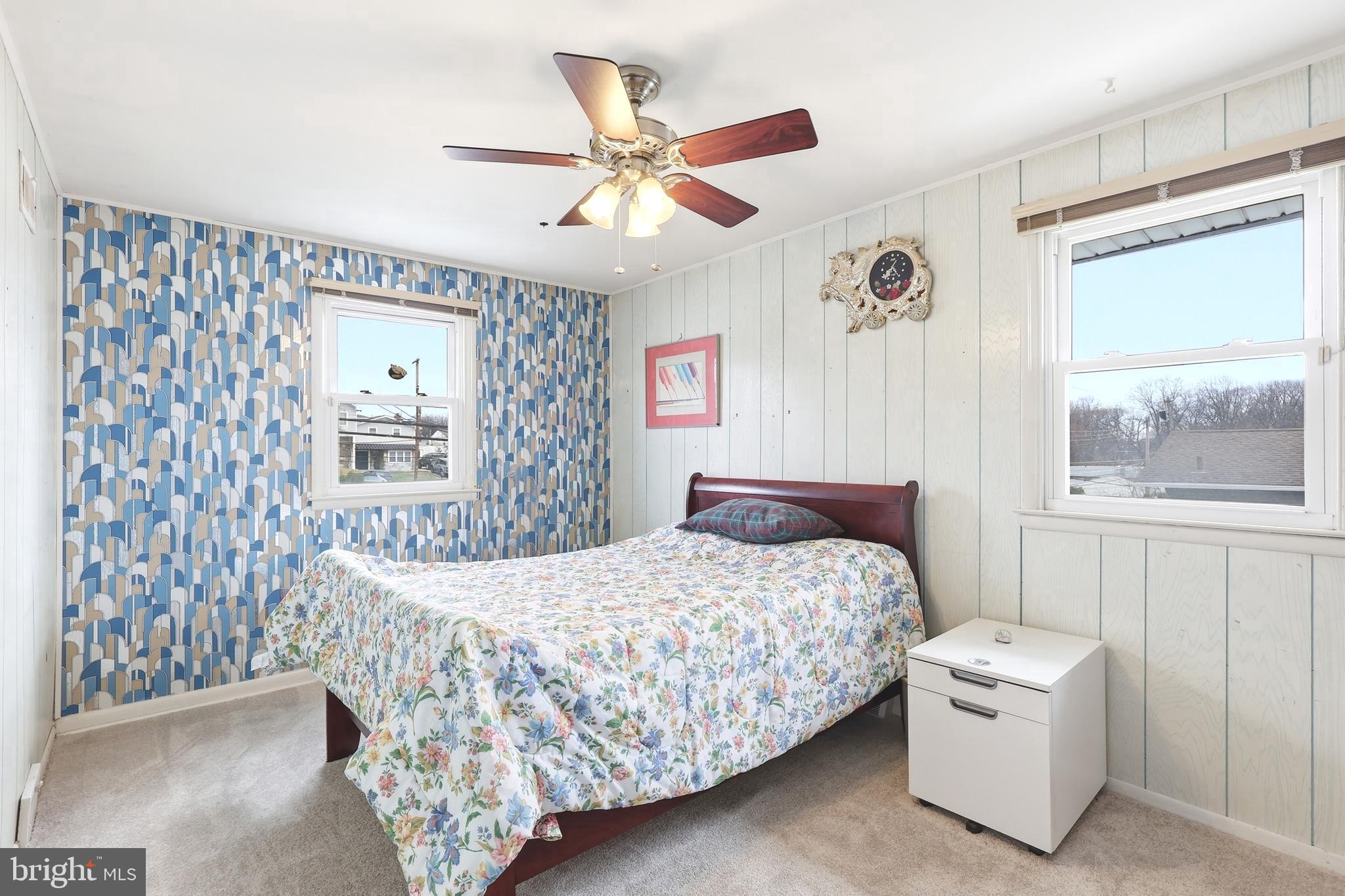 123 Pocasset Road Philadelphia, PA 19115 - Photo 20 of 35 a bedroom with a bed and window with a chandelier
