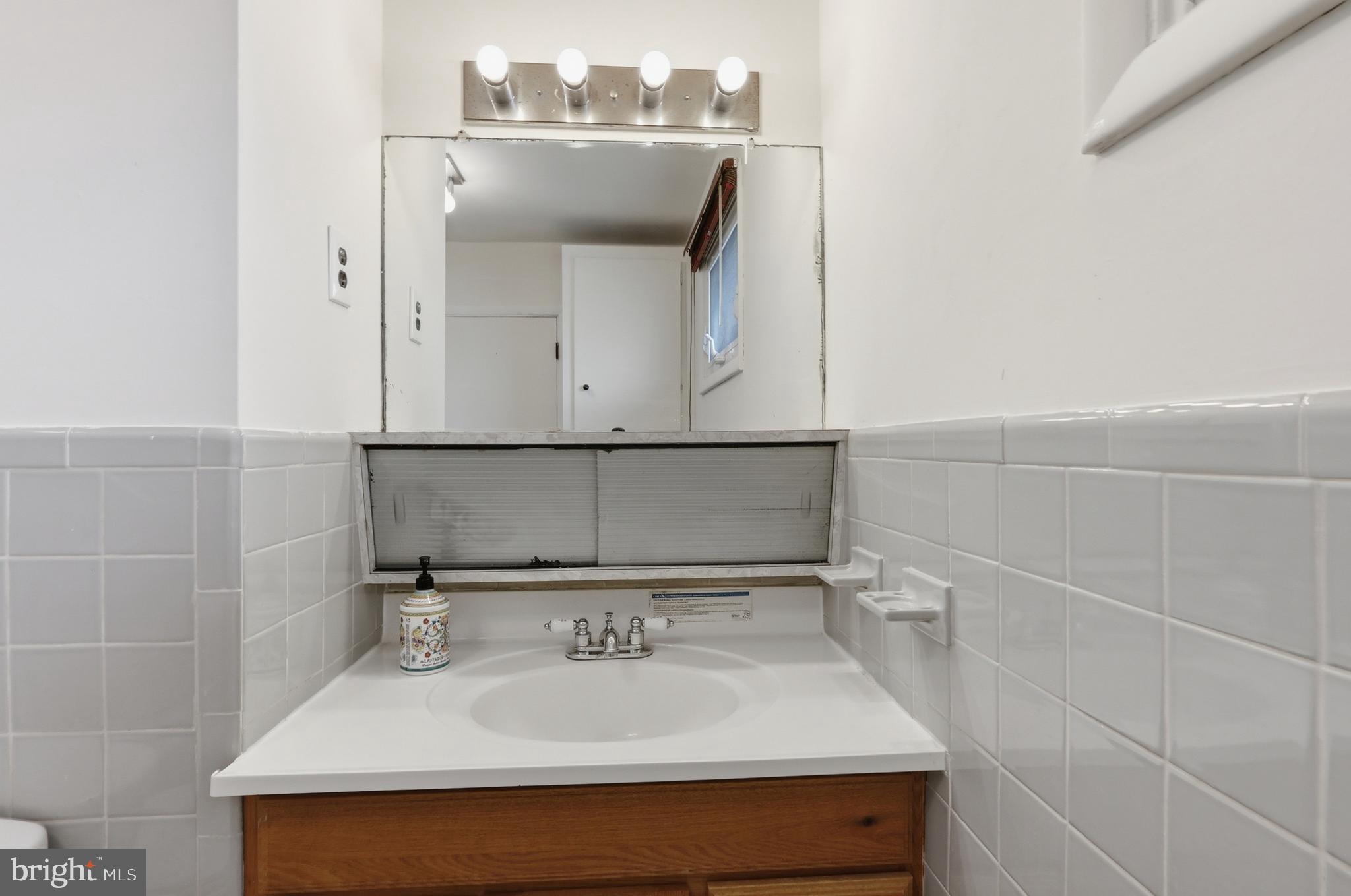 123 Pocasset Road Philadelphia, PA 19115 - Photo 23 of 35 a bathroom with a sink and a mirror
