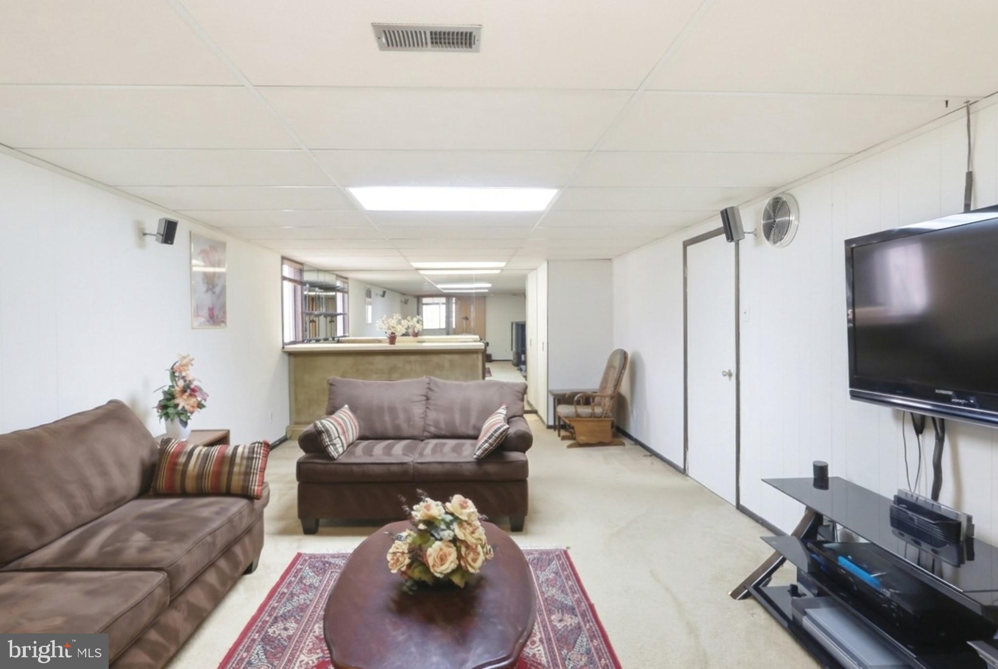 123 Pocasset Road Philadelphia, PA 19115 - Photo 10 of 35 a living room with furniture and a flat screen tv