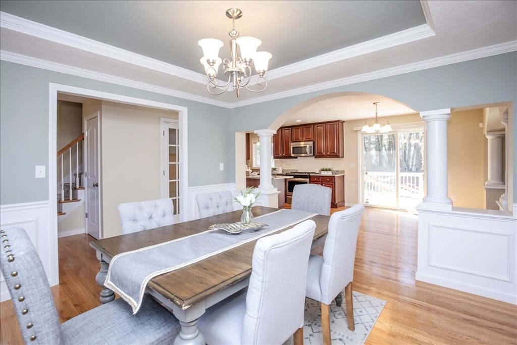 294 River Street Billerica, MA 01821 - Photo 18 of 42 a living room with fireplace furniture and a chandelier
