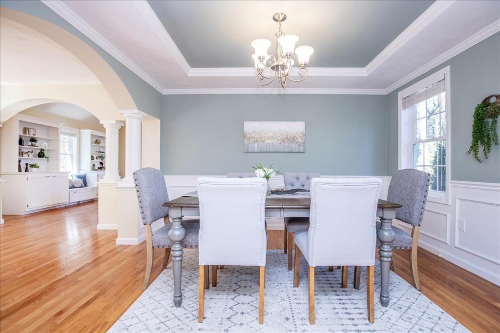 294 River Street Billerica, MA 01821 - Photo 19 of 42 a view of a dining room with furniture a chandelier and wooden floor