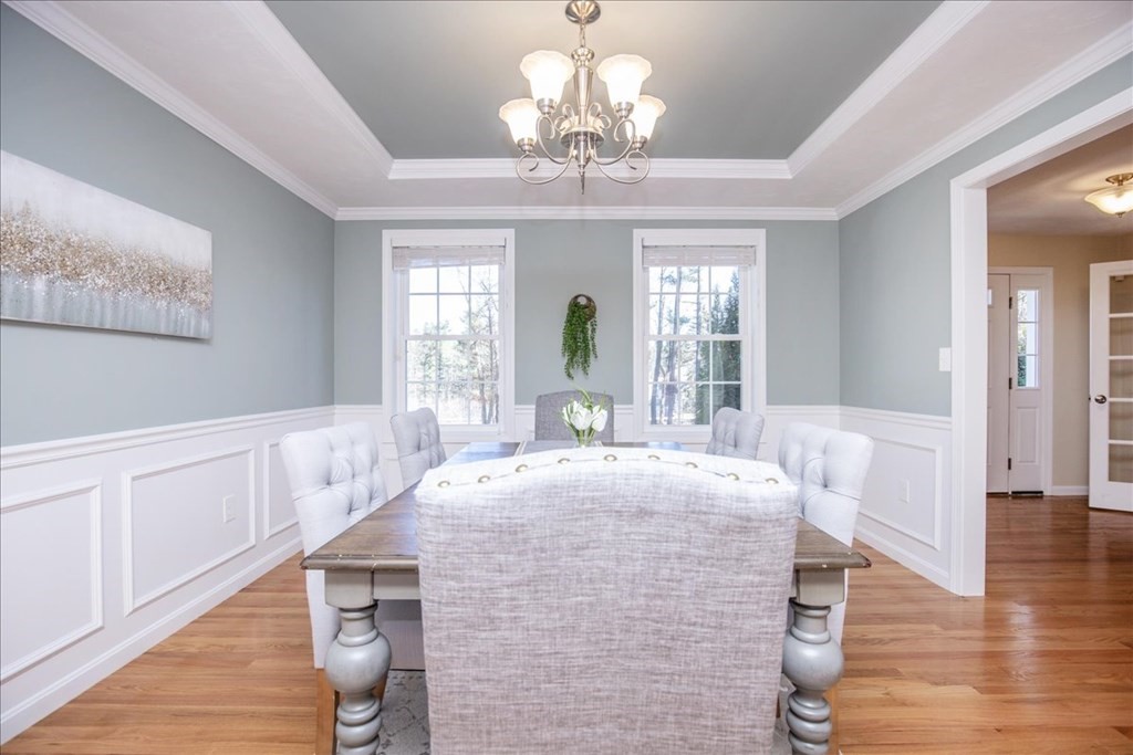 294 River Street Billerica, MA 01821 - Photo 20 of 42 a living room with fireplace furniture and a chandelier