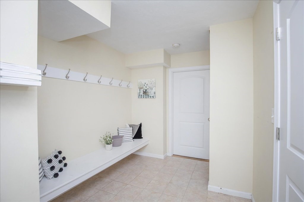 294 River Street Billerica, MA 01821 - Photo 34 of 42 a view of room with cabinet and stairs