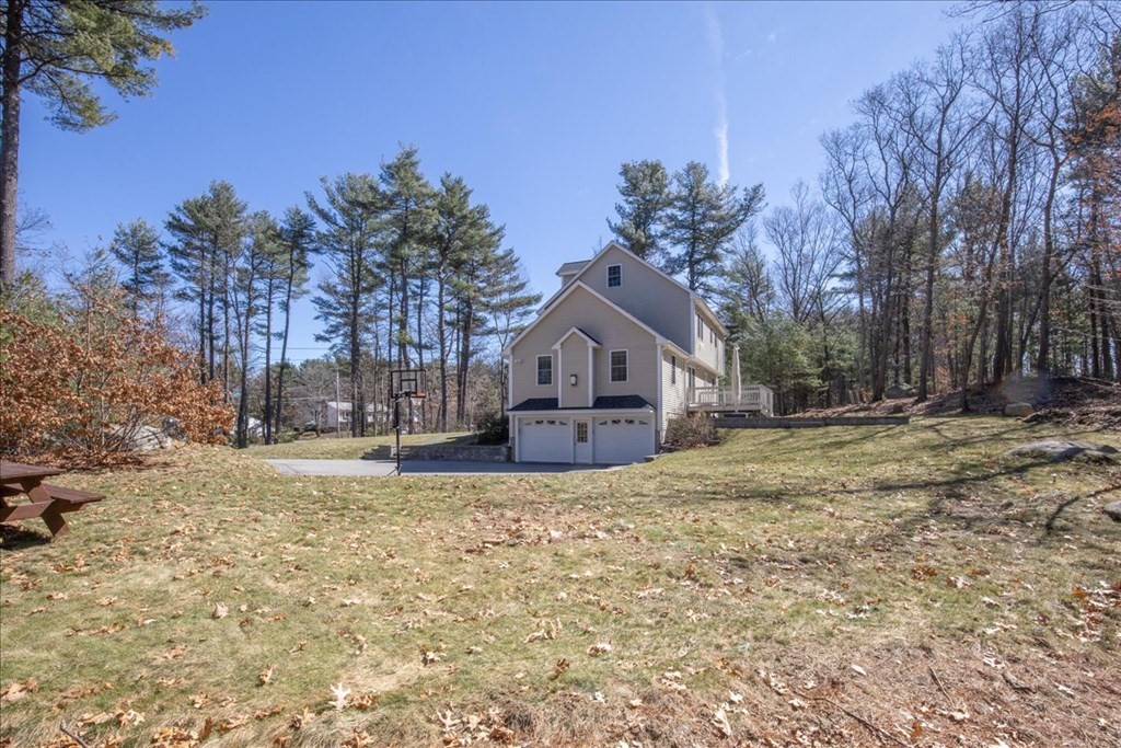 294 River Street Billerica, MA 01821 - Photo 40 of 42 a house with trees in the background