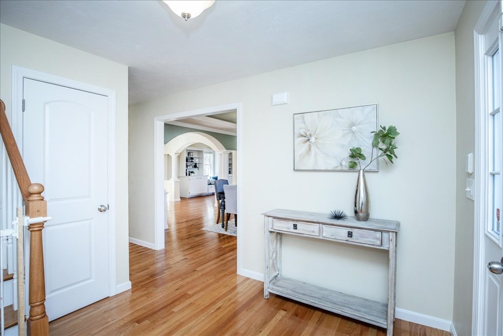 294 River Street Billerica, MA 01821 - Photo 6 of 42 a view of a hallway with wooden floor and cabinet