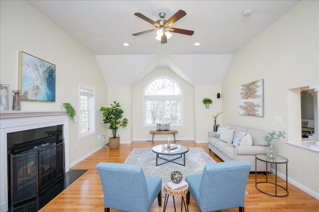 294 River Street Billerica, MA 01821 - Photo 8 of 42 a living room with furniture a fireplace and a large window
