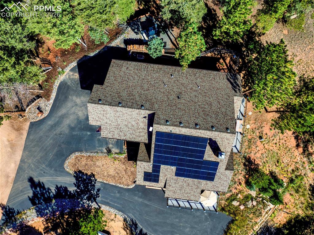 80 Feldspar Road Florissant, CO 80816 - Photo 26 of 31 Outside you can see the fully paved driveway, and those coveted solar panels!