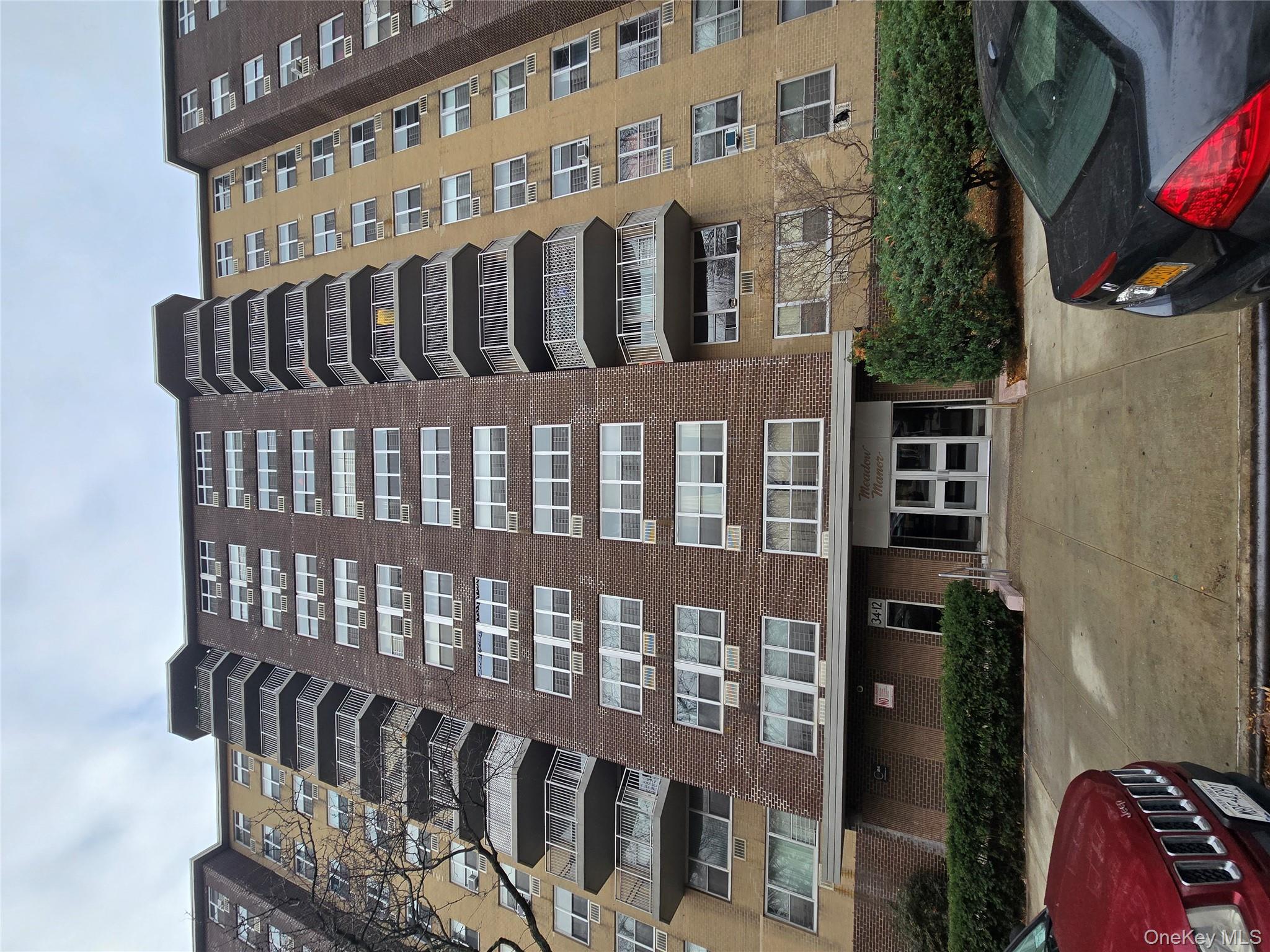 34-12 113th Street, Unit 7L Queens, NY 11368 - Photo 1 of 9 a front view of a multi story building