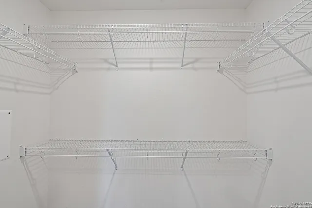 a view of a room with racks on the wall