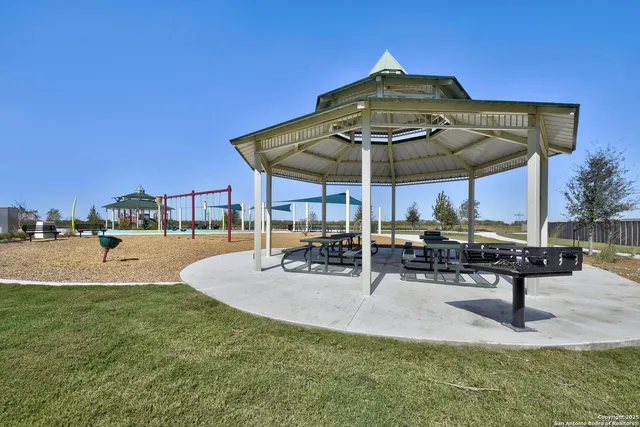 a view of a park with sitting area