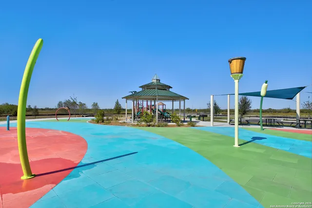 a view of a backyard with swimming pool