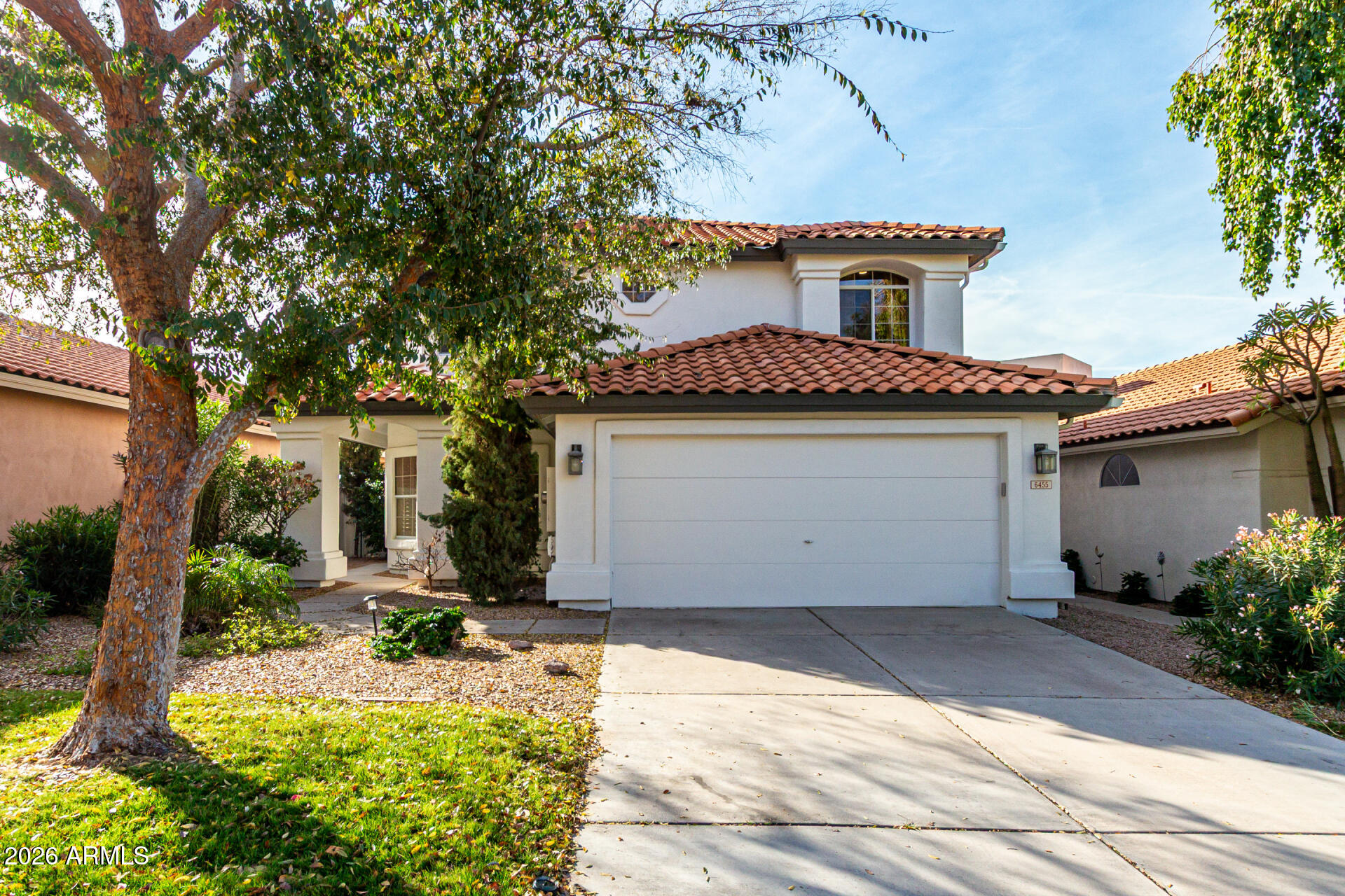 a front view of a house with yard