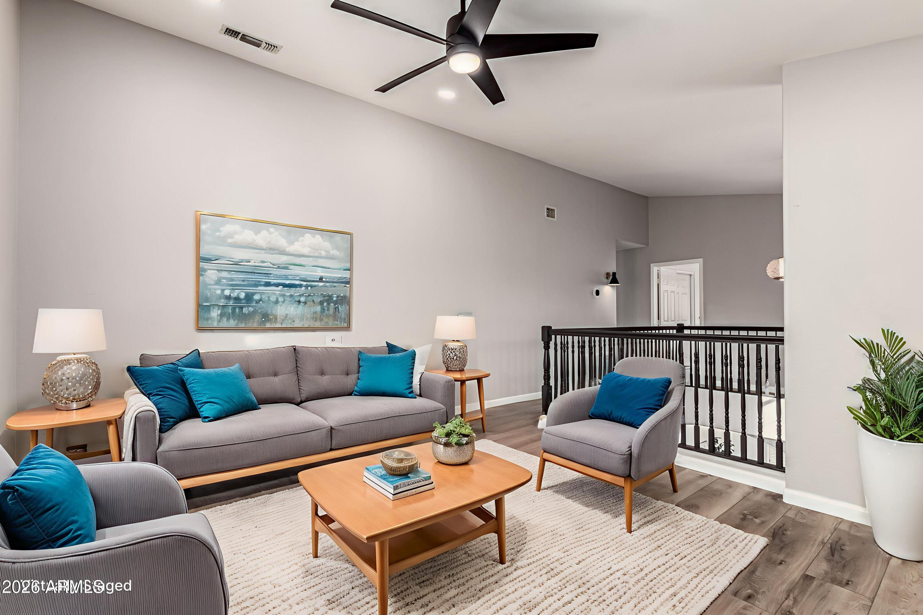 6455 East Raftriver Street Mesa, AZ 85215 - Photo 15 of 36 a living room with furniture and a wooden floor