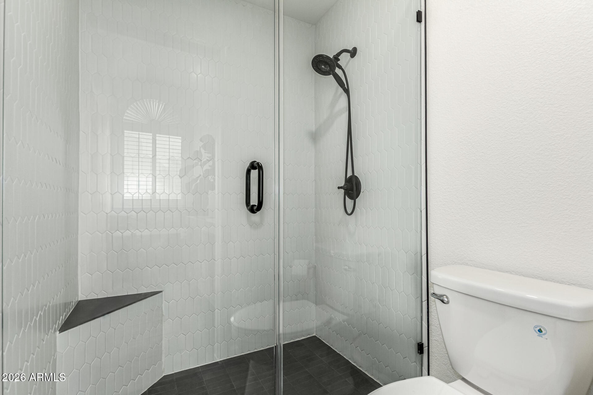 6455 East Raftriver Street Mesa, AZ 85215 - Photo 21 of 36 a bathroom with a shower and toilet