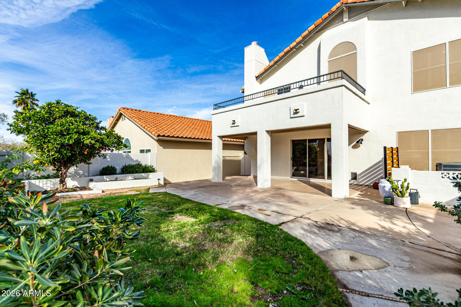 6455 East Raftriver Street Mesa, AZ 85215 - Photo 35 of 36 a front view of a house with a yard and garage