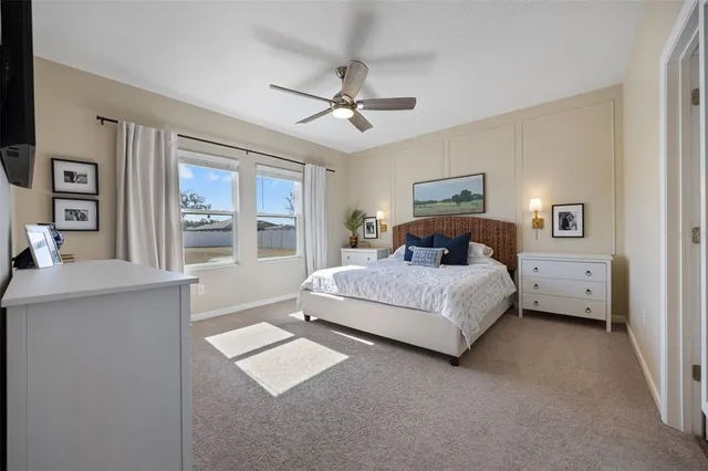 a bedroom with a large bed and a window