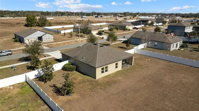 an aerial view of a house with lake view
