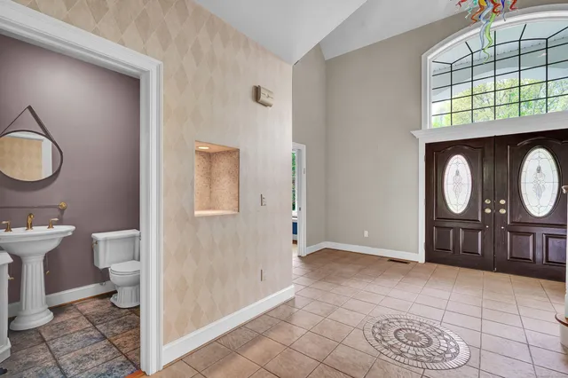 a view of a bathroom with wooden floor windows and a sink