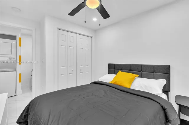 a bedroom with a bed and a couch