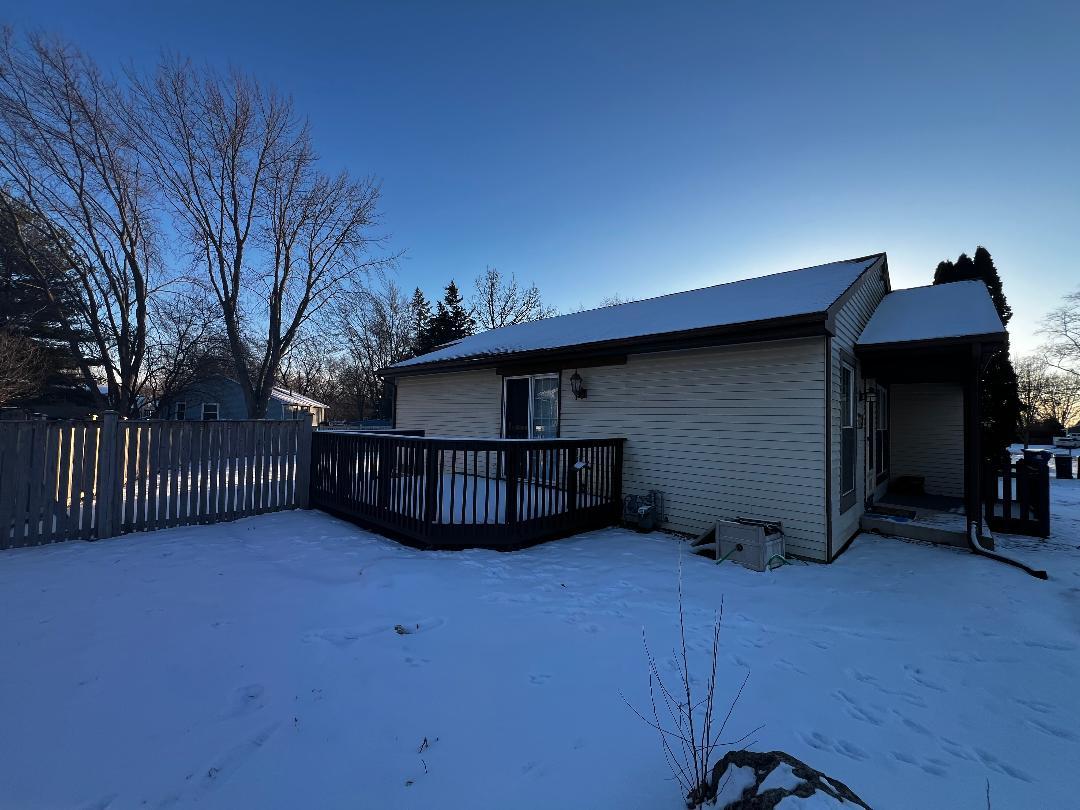 1944 Navarone Drive Naperville, IL 60565 - Photo 2 of 9 a view of a house with wooden fence and a roof deck