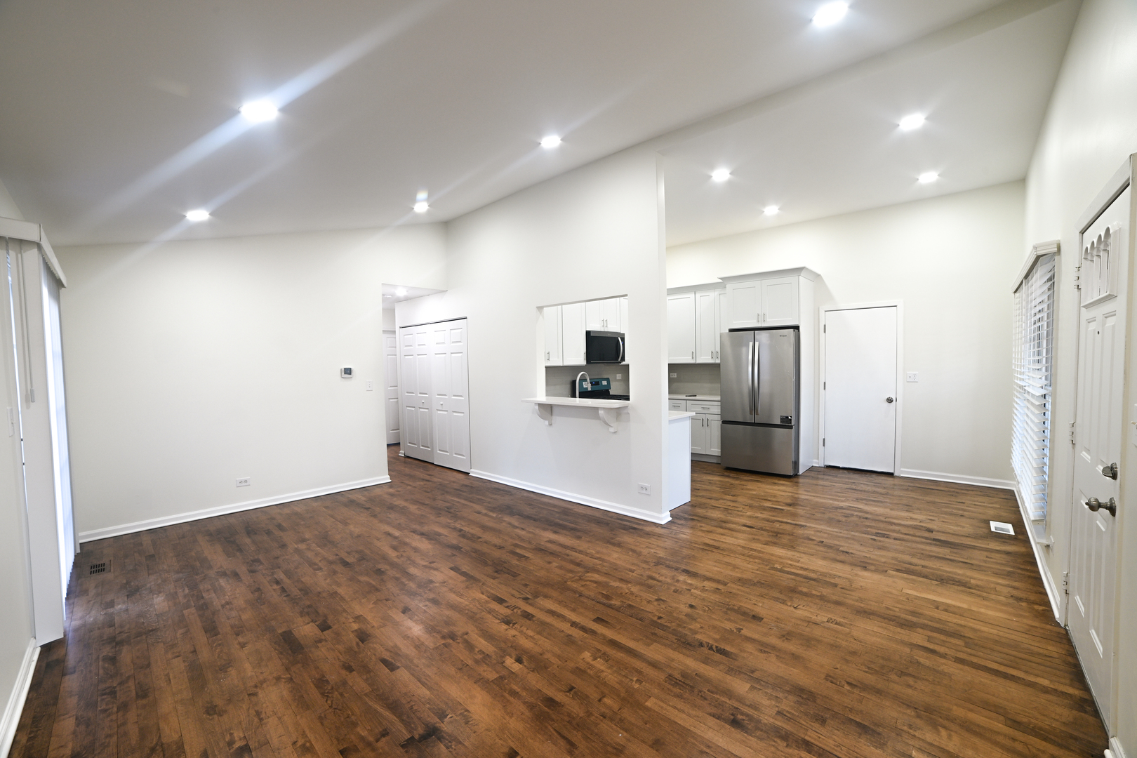 1944 Navarone Drive Naperville, IL 60565 - Photo 2 of 6 a view of empty room with wooden floor