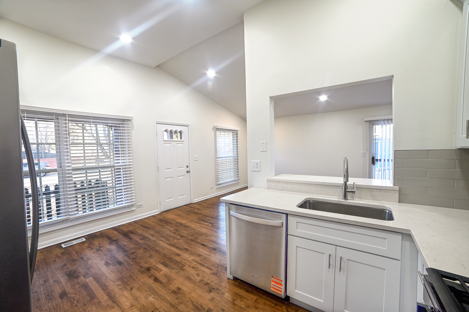 1944 Navarone Drive Naperville, IL 60565 - Photo 4 of 6 a kitchen with a sink cabinets and wooden floor