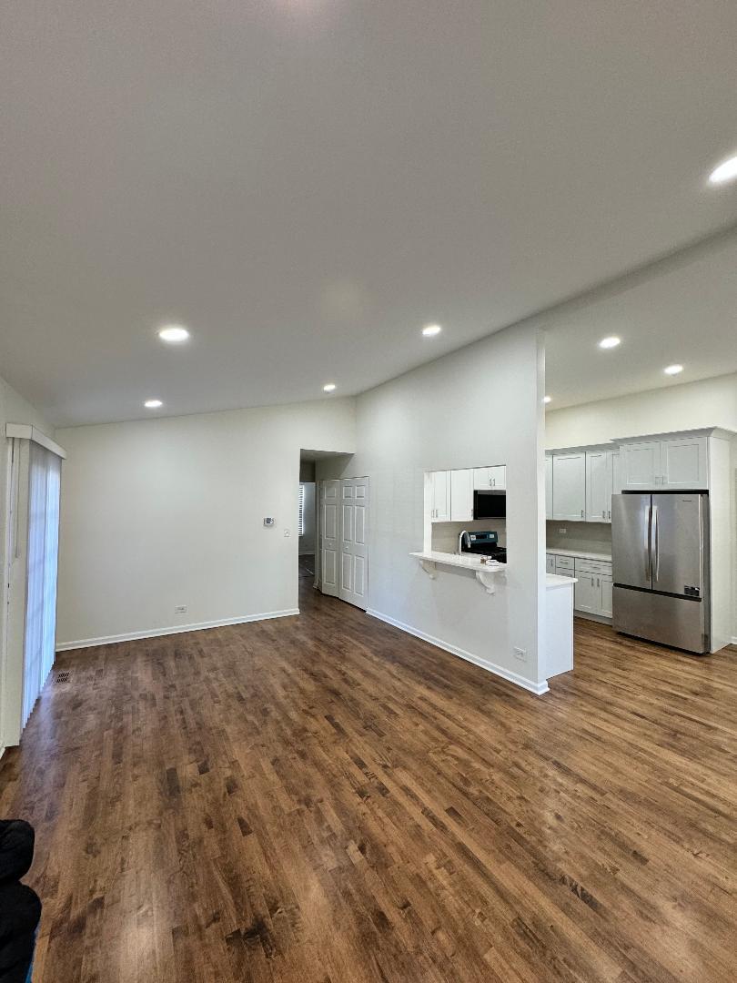 1944 Navarone Drive Naperville, IL 60565 - Photo 4 of 9 a view of a livingroom with kitchen