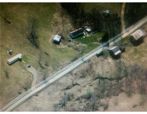 505 Craig Run Road Waynesburg, PA 15370 - Photo 12 of 12 Land. Trailer on left house on right,barns across the road.