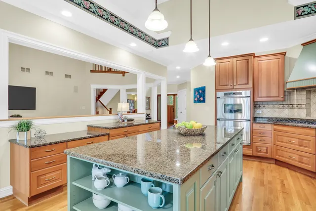 a kitchen with stainless steel appliances granite countertop a sink counter space and cabinets