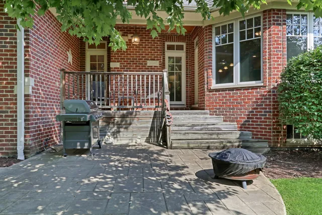 a view of a chair and table in backyard