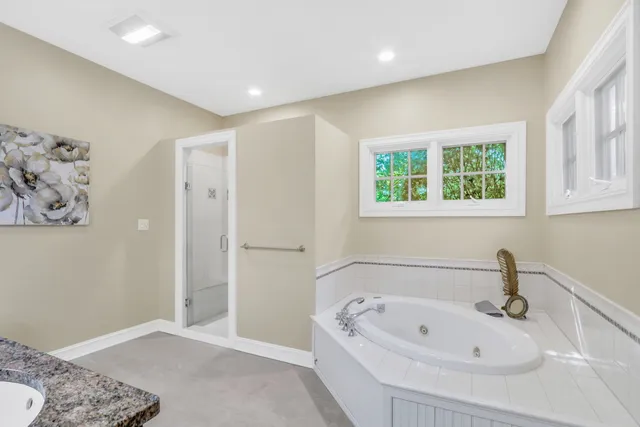 a bathroom with a bathtub and a sink