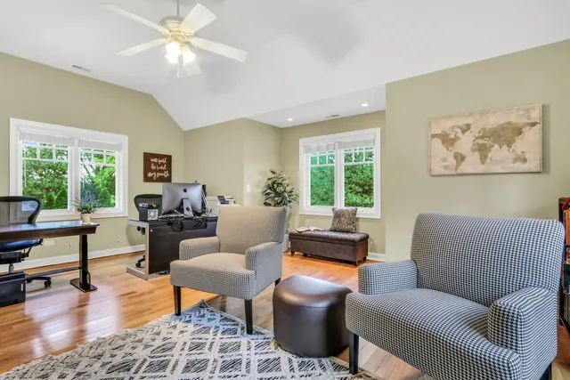 a living room with furniture a fireplace and a window