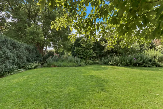 an aerial view of house with yard