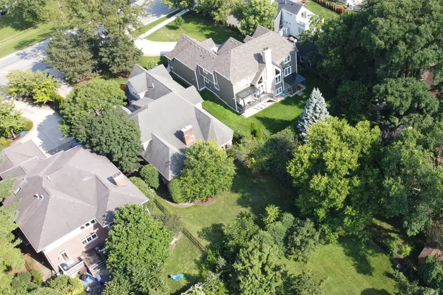 an aerial view of a house with a garden and swimming pool
