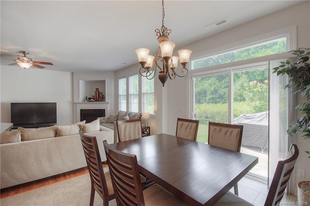 6831 Maricopa Road Charlotte, NC 28277 - Photo 11 of 23 a view of a dining room with furniture window and wooden floor