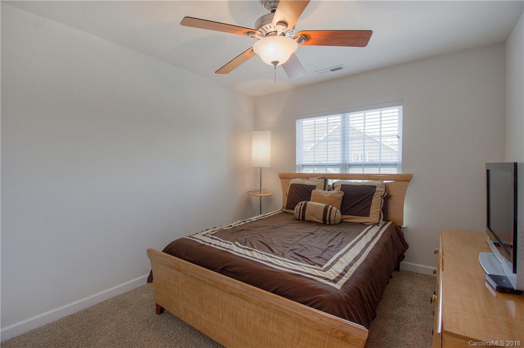 6831 Maricopa Road Charlotte, NC 28277 - Photo 16 of 23 a bed room with a bed and a flat screen tv