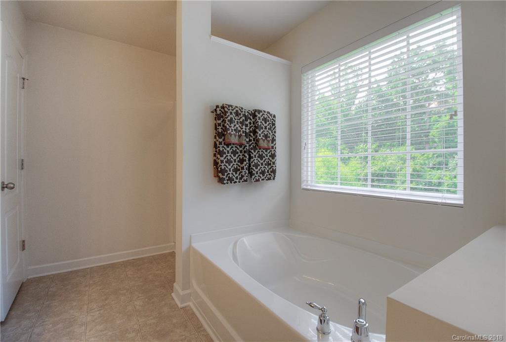 6831 Maricopa Road Charlotte, NC 28277 - Photo 20 of 23 a bathroom with a bathtub and window