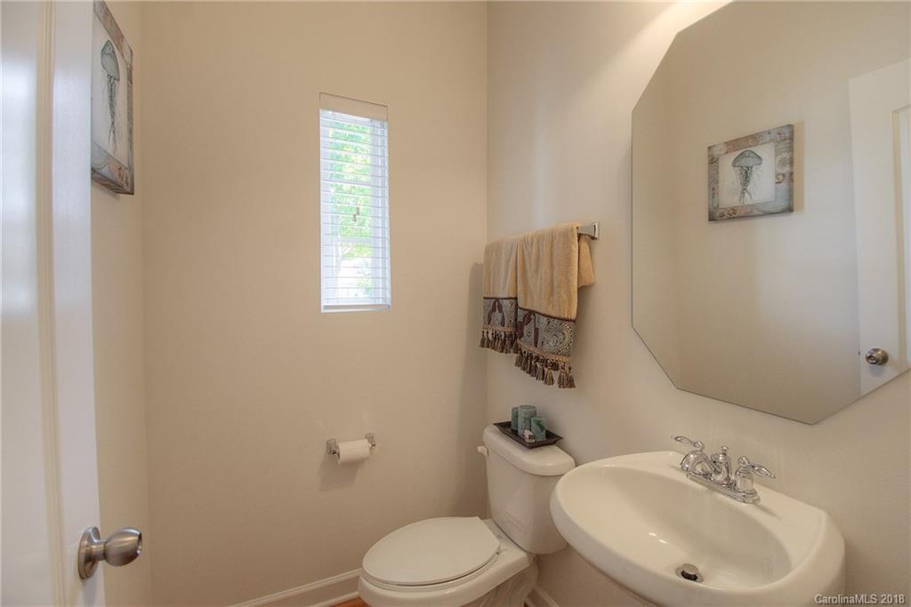 6831 Maricopa Road Charlotte, NC 28277 - Photo 6 of 23 a bathroom with a toilet sink and mirror
