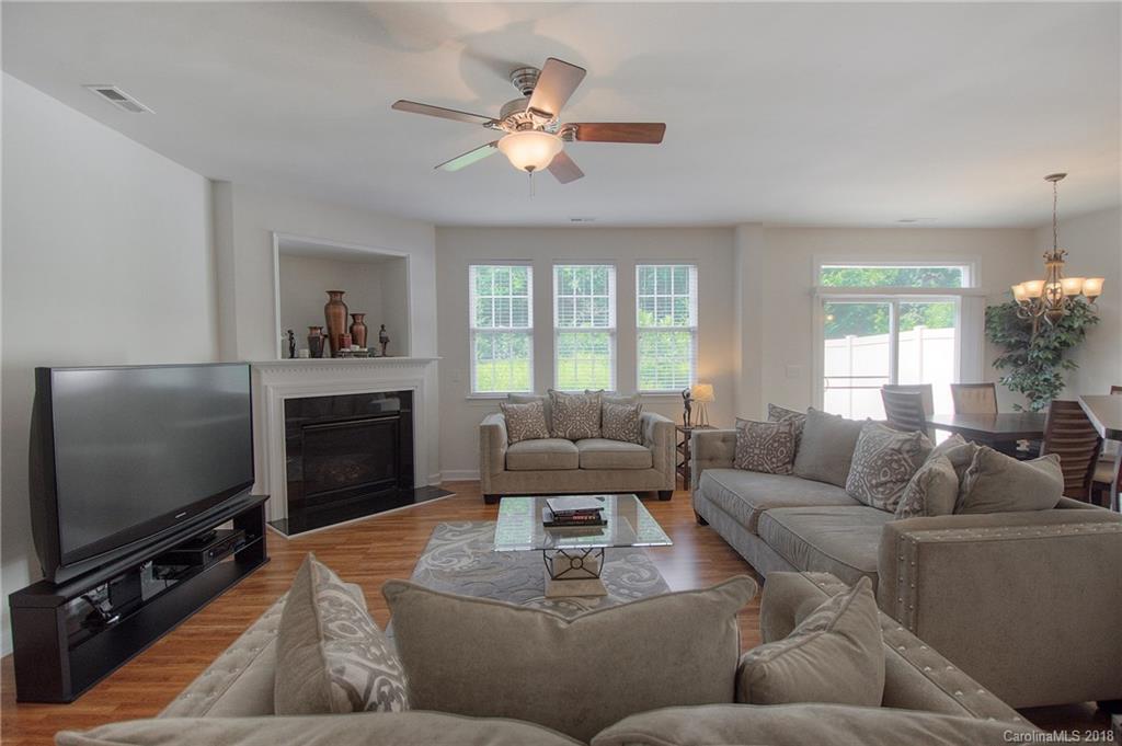 6831 Maricopa Road Charlotte, NC 28277 - Photo 8 of 23 a living room with furniture a large window and a flat screen tv