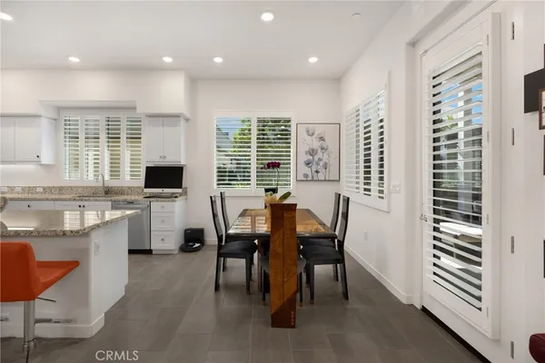 a view of a patio with table and chairs with wooden floor
