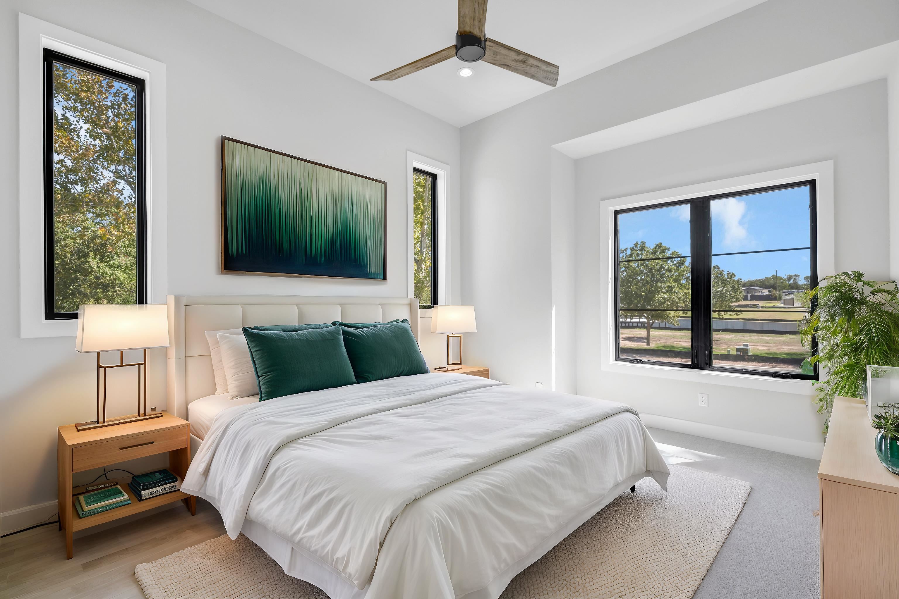 509 Lake Street Kingsland, TX 78639 - Photo 13 of 29 a bedroom with a large bed and a flat tv screen on dresser