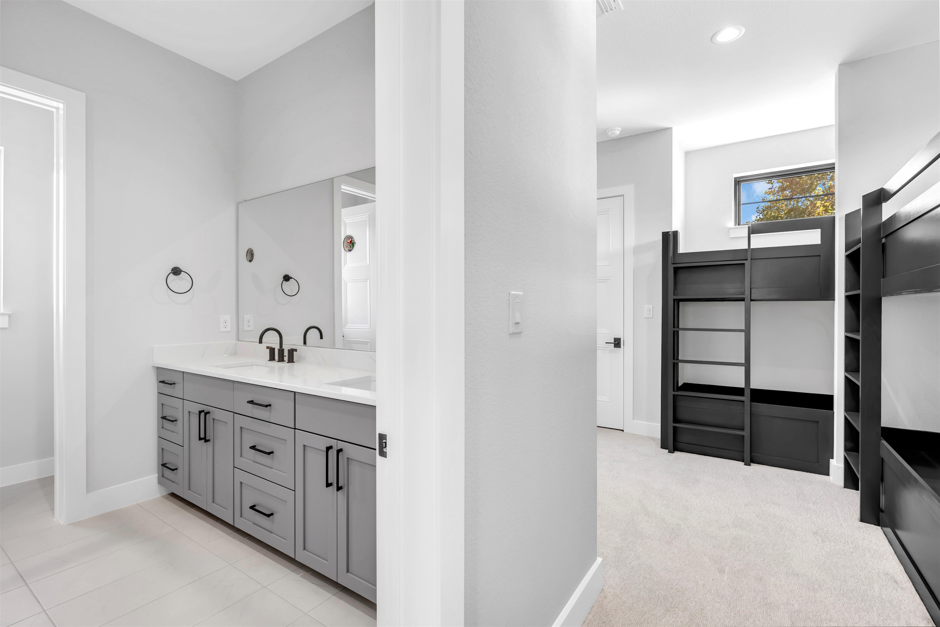 509 Lake Street Kingsland, TX 78639 - Photo 16 of 29 a spacious bathroom with a double vanity sink and a mirror