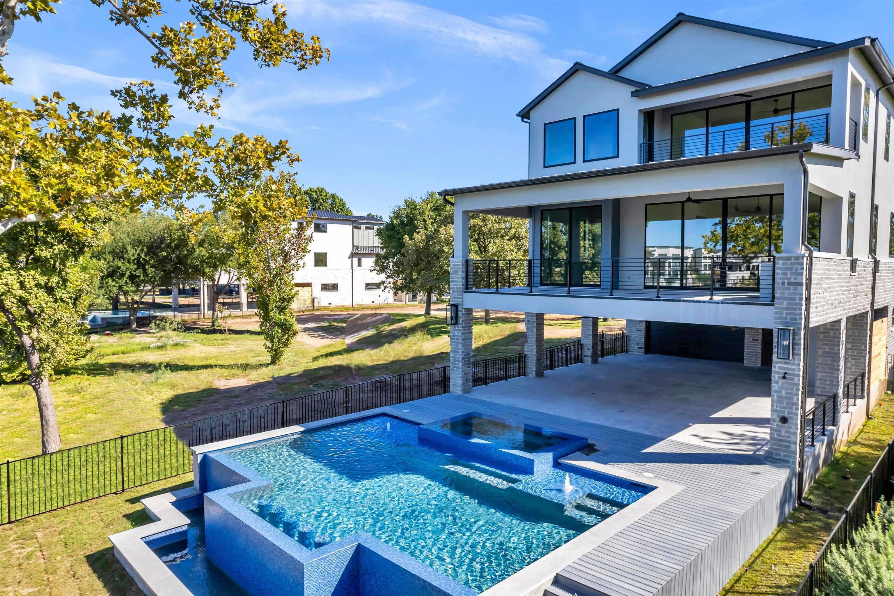509 Lake Street Kingsland, TX 78639 - Photo 2 of 29 a view of a house with swimming pool lawn chairs and a yard