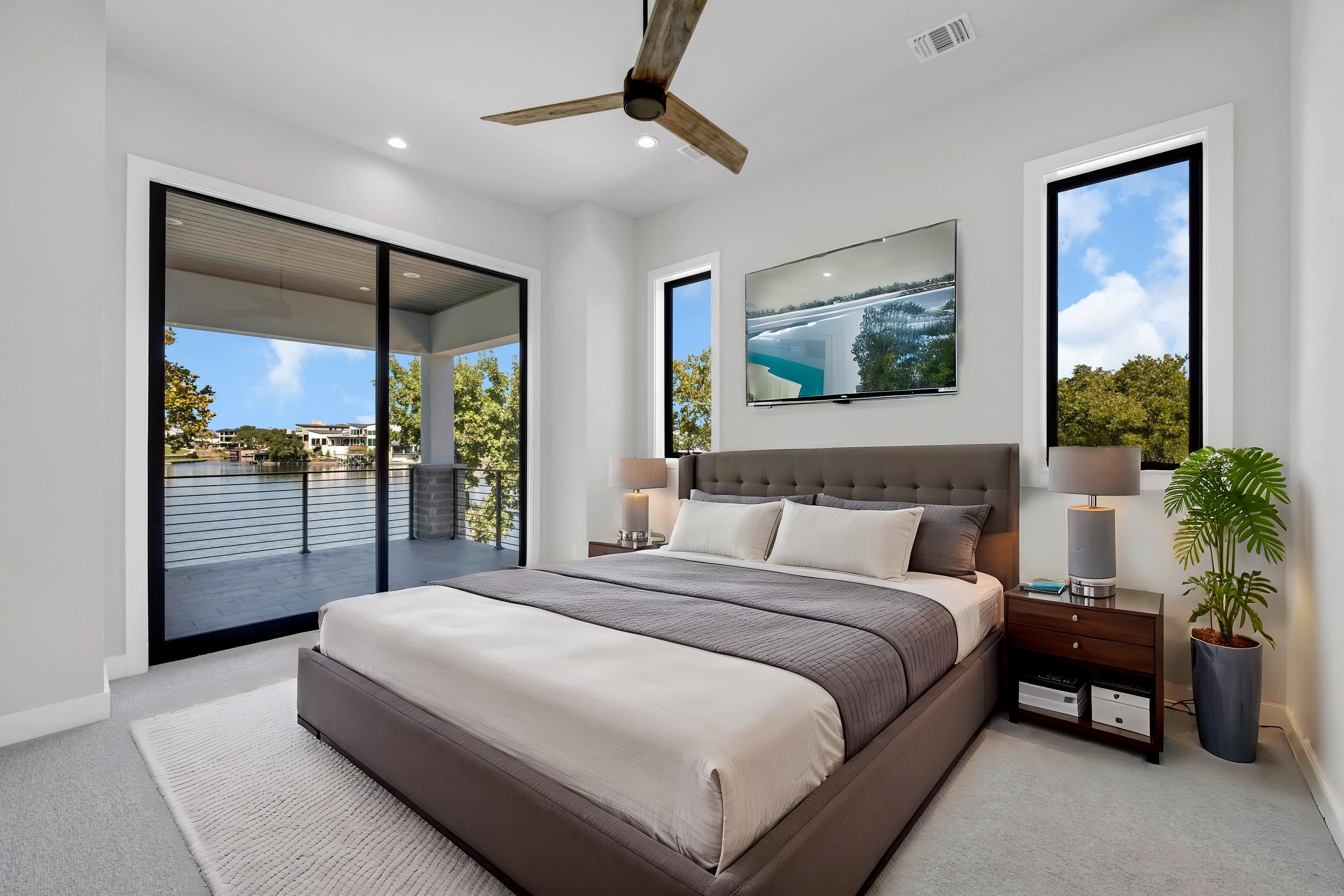 509 Lake Street Kingsland, TX 78639 - Photo 6 of 29 a spacious bedroom with a large bed and a chandelier