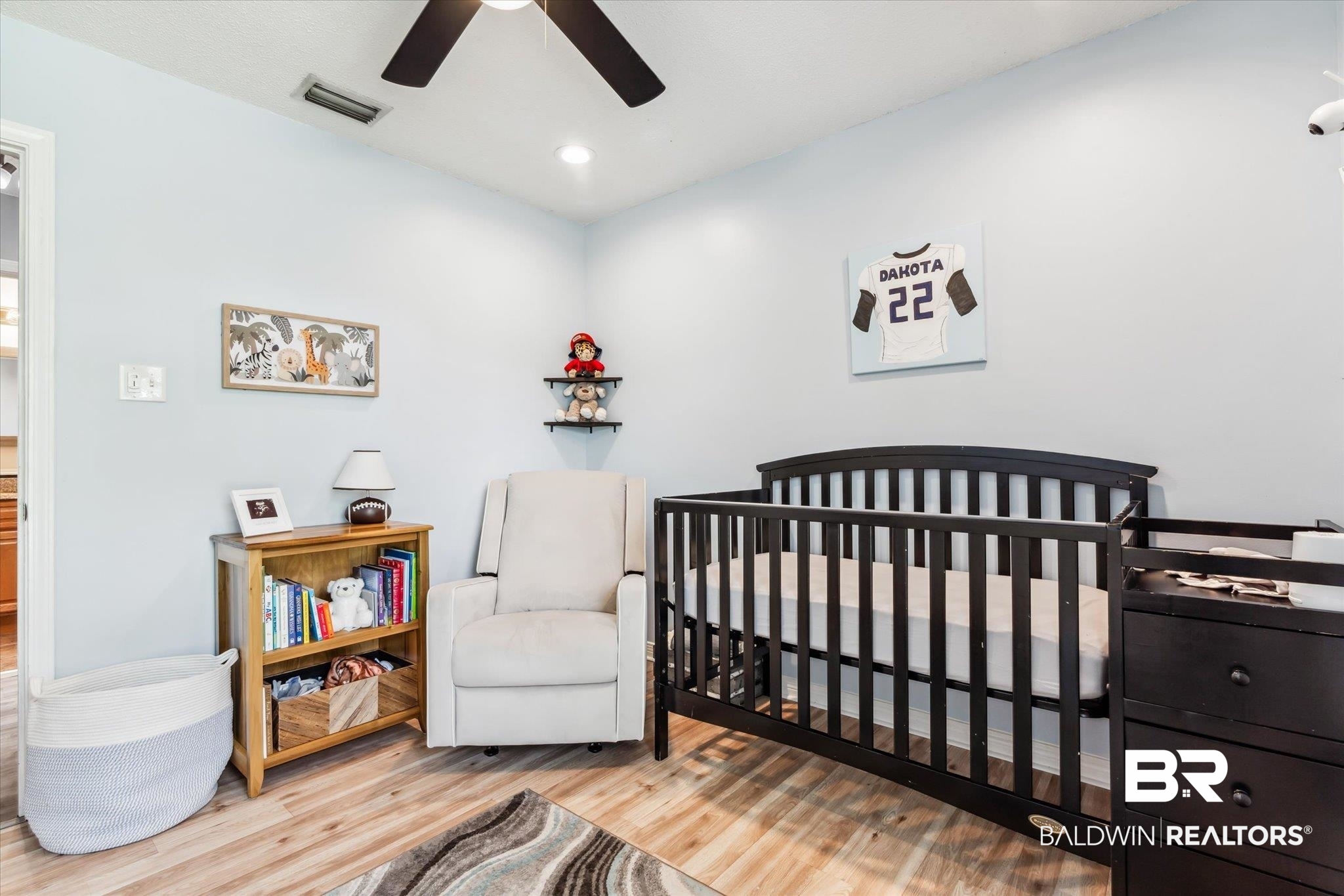 9306 Prairie Drive Semmes, AL 36575 - Photo 14 of 20 Bedroom featuring a crib, light wood-type flooring, and ceiling fan
